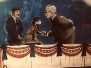 A vibrant dog park bathed in sunlight features abundant greenery with mature trees, offering ample shade for leisurely outdoor activities. In the distance is a well-equipped playground that presents an additional activity area. An inviting picnic table spreads out nearby, ideal for enjoying meals al fresco or taking relaxing breaks from play. A neatly-placed trash bin aids in maintaining the park's cleanliness for everyone's enjoyment. Dominating the scene is a generously wide dirt path gracefully curving through the expanse of grass, promising exploratory walks and lively fetch games.