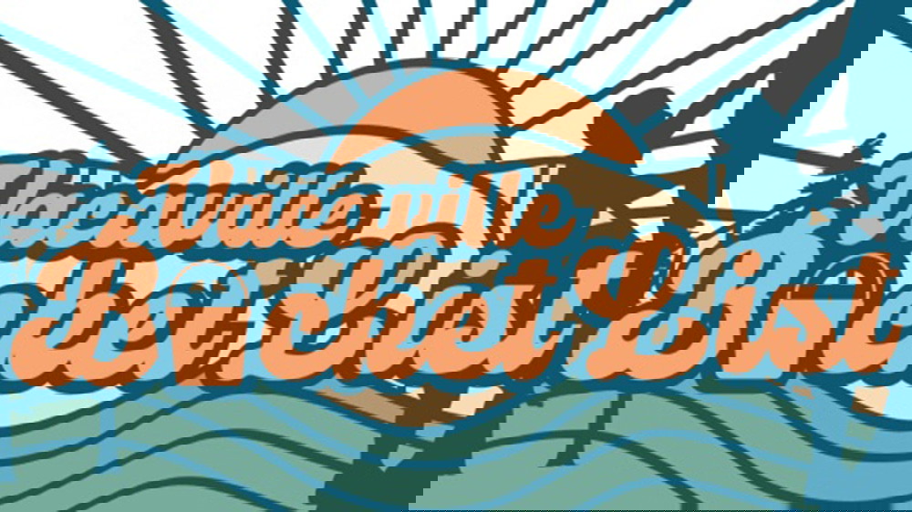 A vibrant dog park bathed in sunlight features abundant greenery with mature trees, offering ample shade for leisurely outdoor activities. In the distance is a well-equipped playground that presents an additional activity area. An inviting picnic table spreads out nearby, ideal for enjoying meals al fresco or taking relaxing breaks from play. A neatly-placed trash bin aids in maintaining the park's cleanliness for everyone's enjoyment. Dominating the scene is a generously wide dirt path gracefully curving through the expanse of grass, promising exploratory walks and lively fetch games.